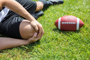 Rugby Player Suffering From Knee Injury